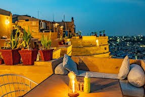 Lantern-lit terrace seating at dusk