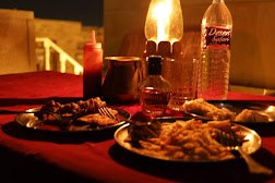 Dinner served on the terrace after dark